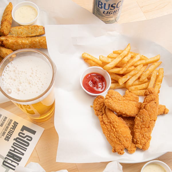 Bronko's Pizza chicken tenders, fries with ketchup, cheese sticks with dip, and a beer.
